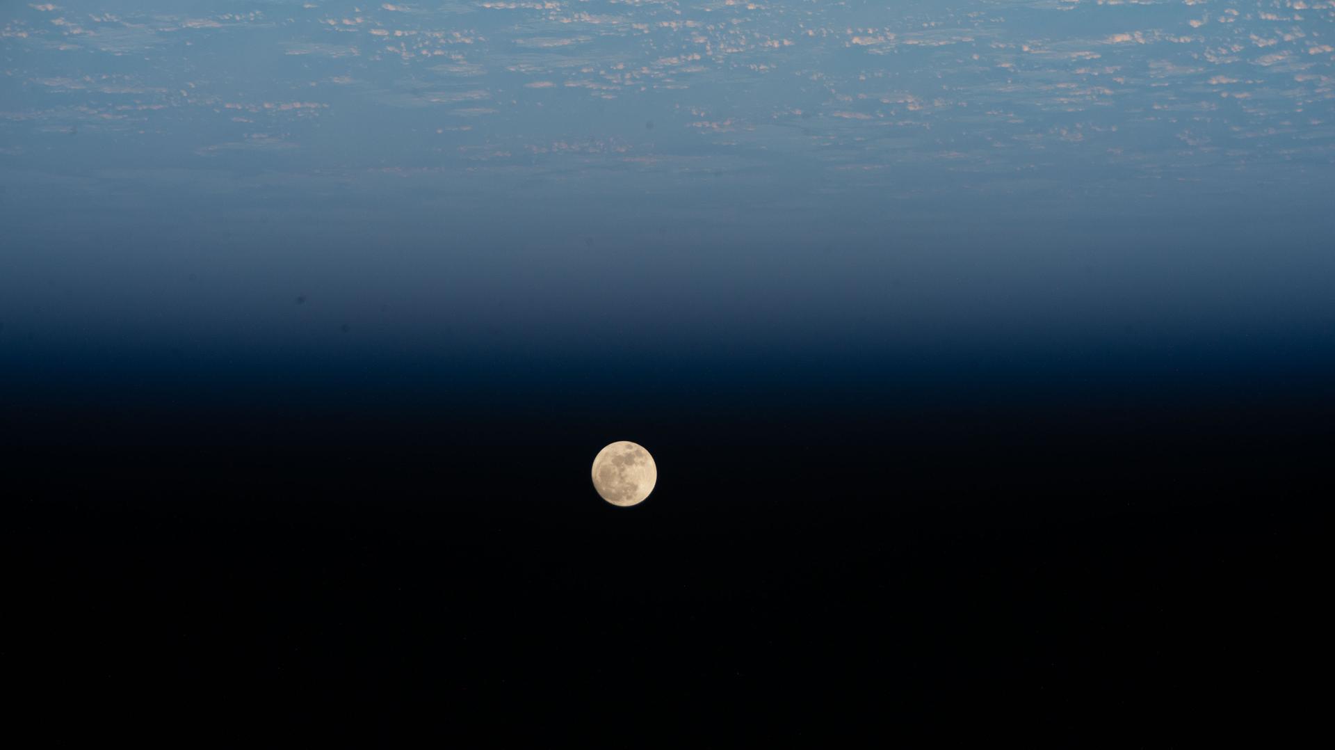 A Waxing Gibbous Moon is pictured above the Pacific Ocean northeast of New Zealand in this photograph from the International Space Station as it orbited 266 miles above Earth.