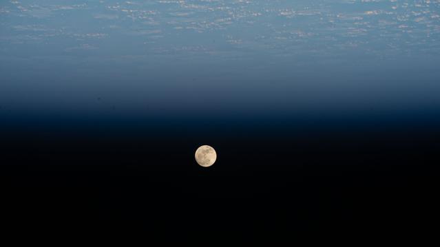 A Waxing Gibbous Moon is pictured above the Pacific Ocean