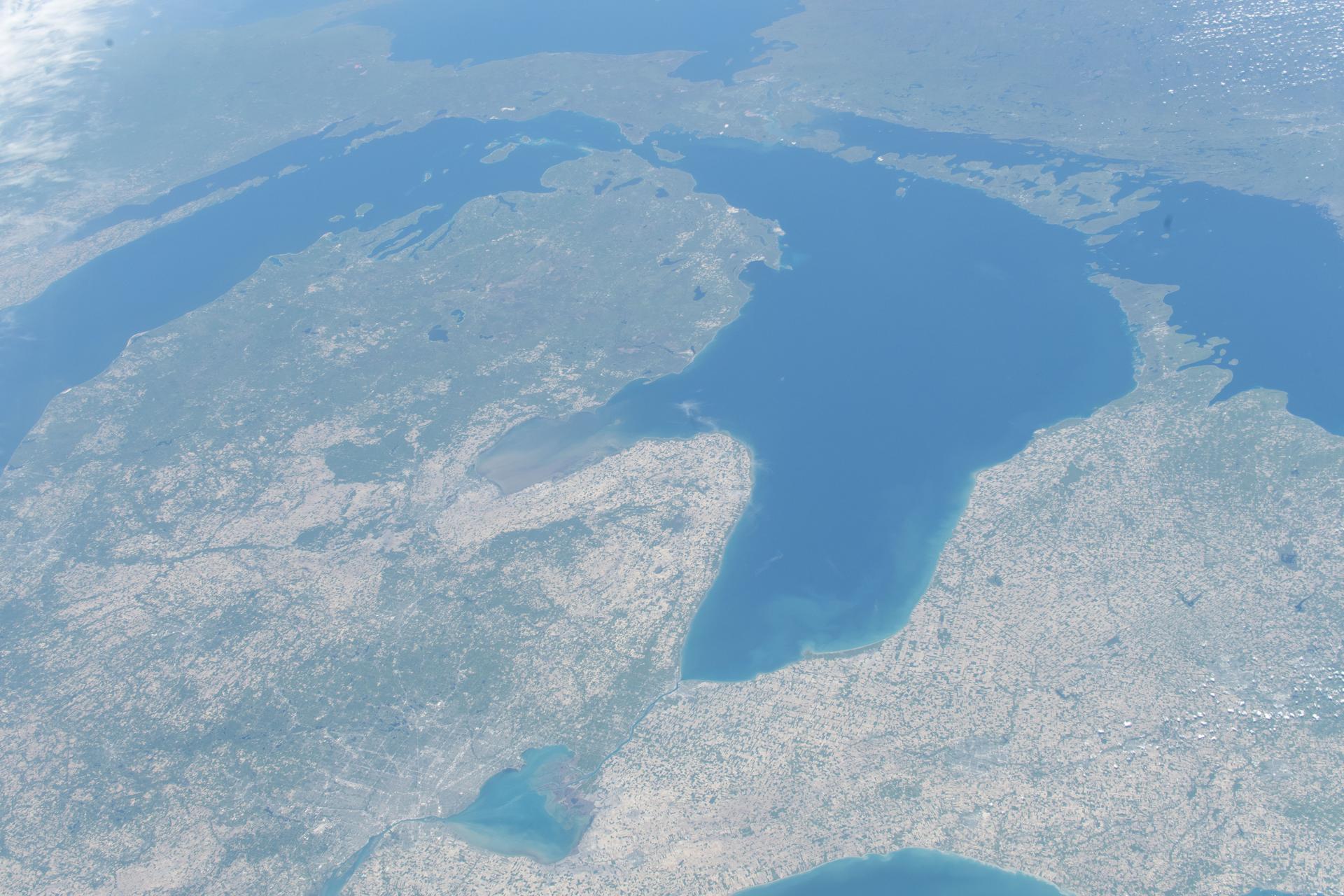 From left, Lake Michigan, Lake Huron, and Georgian Bay figure prominently in this photograph from the International Space Station as it orbited 261 miles above North America. Detroit, Michigan, is at the bottom center near Lake St. Clair, which connects Lake Huron with Lake Erie, partially visible at the bottom.