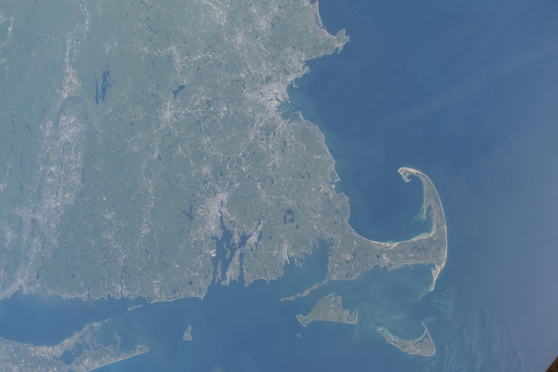 Massachusetts’ Cape Cod peninsula and the southern New England coastline extending from Rhode Island to Connecticut are featured prominently in this photograph from the International Space Station as it orbited 261 miles above the Atlantic Ocean.