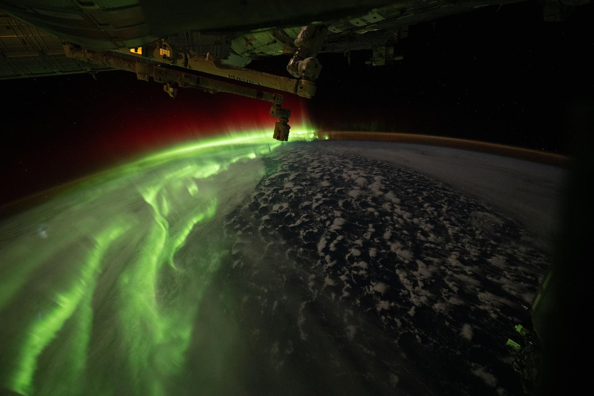 The aurora australis streams across Earth during an active solar event in this photograph taken at approximately 12:36 a.m. local time from the International Space Station as it orbited 273 miles above the Indian Ocean south of Perth, Australia.