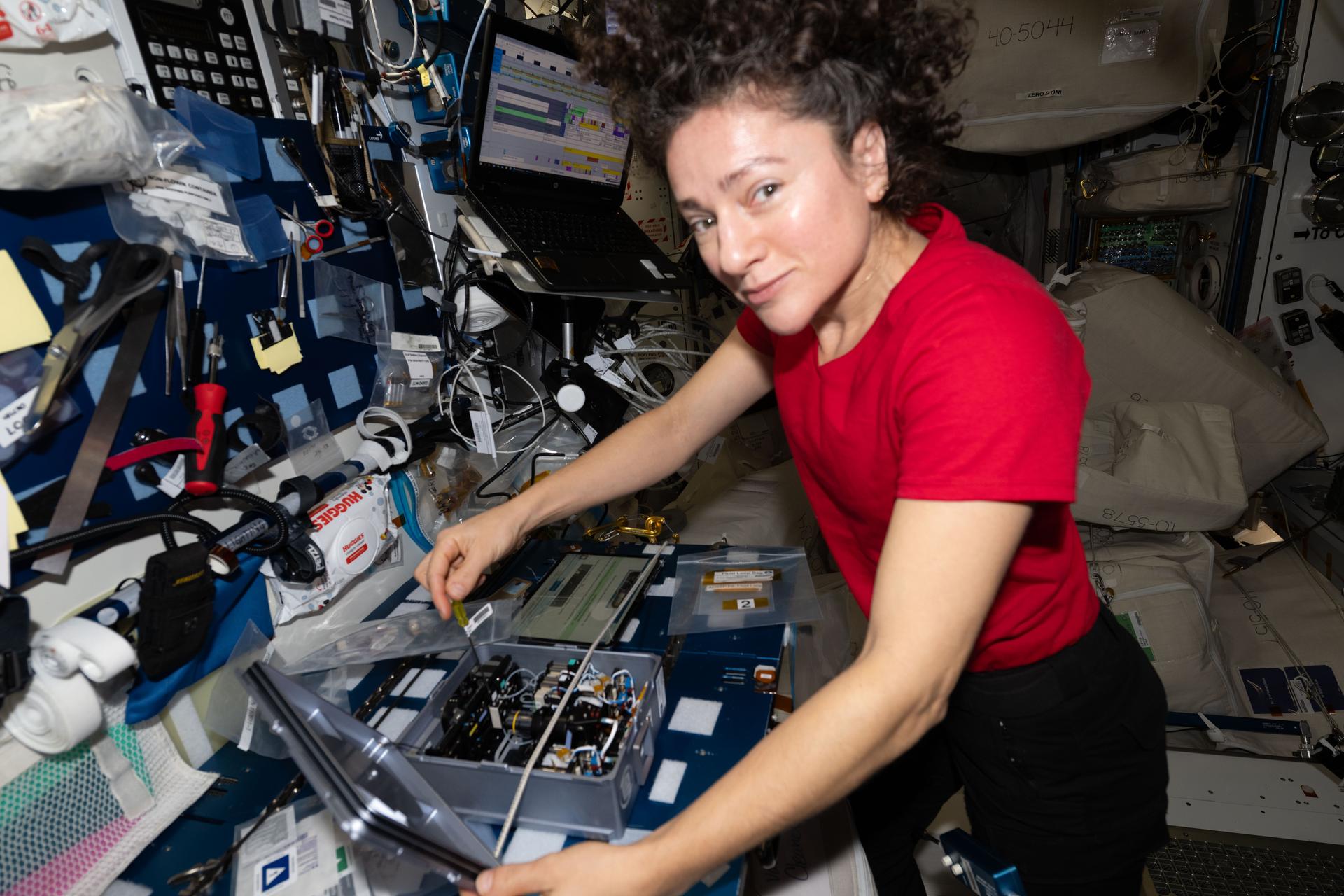 NASA astronaut and Expedition 74 flight engineer Jessica Meir removes components from inside the Advanced Space Experiment Processor‑4, a research device that supports the processing of scientific samples, increasing the International Space Station's capacity for microgravity research.