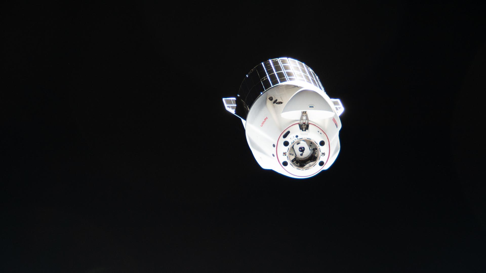 A SpaceX Dragon cargo spacecraft departs from the International Space Station after undocking from the Harmony module's forward port. Dragon, packed with completed science experiments and cargo for retrieval and analysis on Earth, parachuted to a splashdown off the coast of southern California the following day.