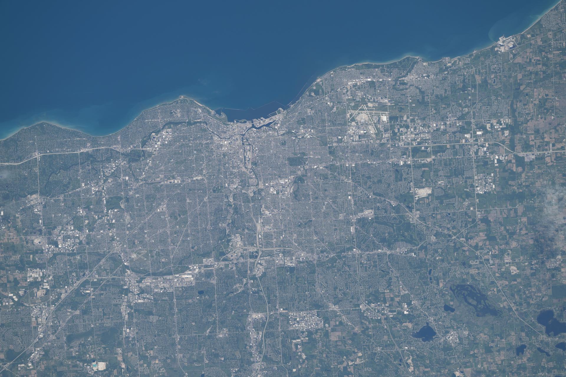 Milwaukee, Wisconsin, located on Lake Michigan, has a metropolitan population of about 1.57 million and supports a strong precision manufacturing sector along with a thriving brewery culture. Near the top right is Milwaukee Mitchell International Airport, which served roughly 5.9 million passengers in 2025.