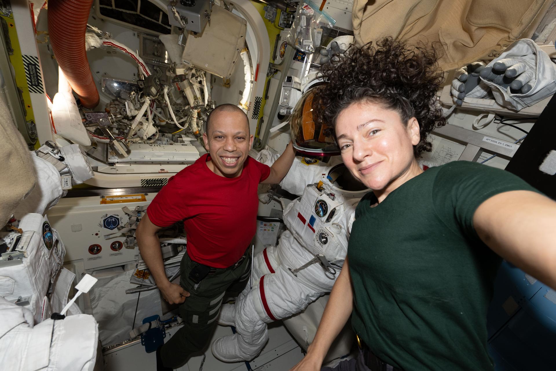 NASA astronauts Jessica Meir and Chris Williams, both Expedition 74 flight engineers, pose for a portrait inside the International Space Station's Quest airlock while preparing their spacesuits. The following day, Meir and Williams wore the suits and exited Quest to conduct a seven-hour-and-20-minute spacewalk and replace a malfunctioning wrist joint on the Canadarm2 robotic arm.