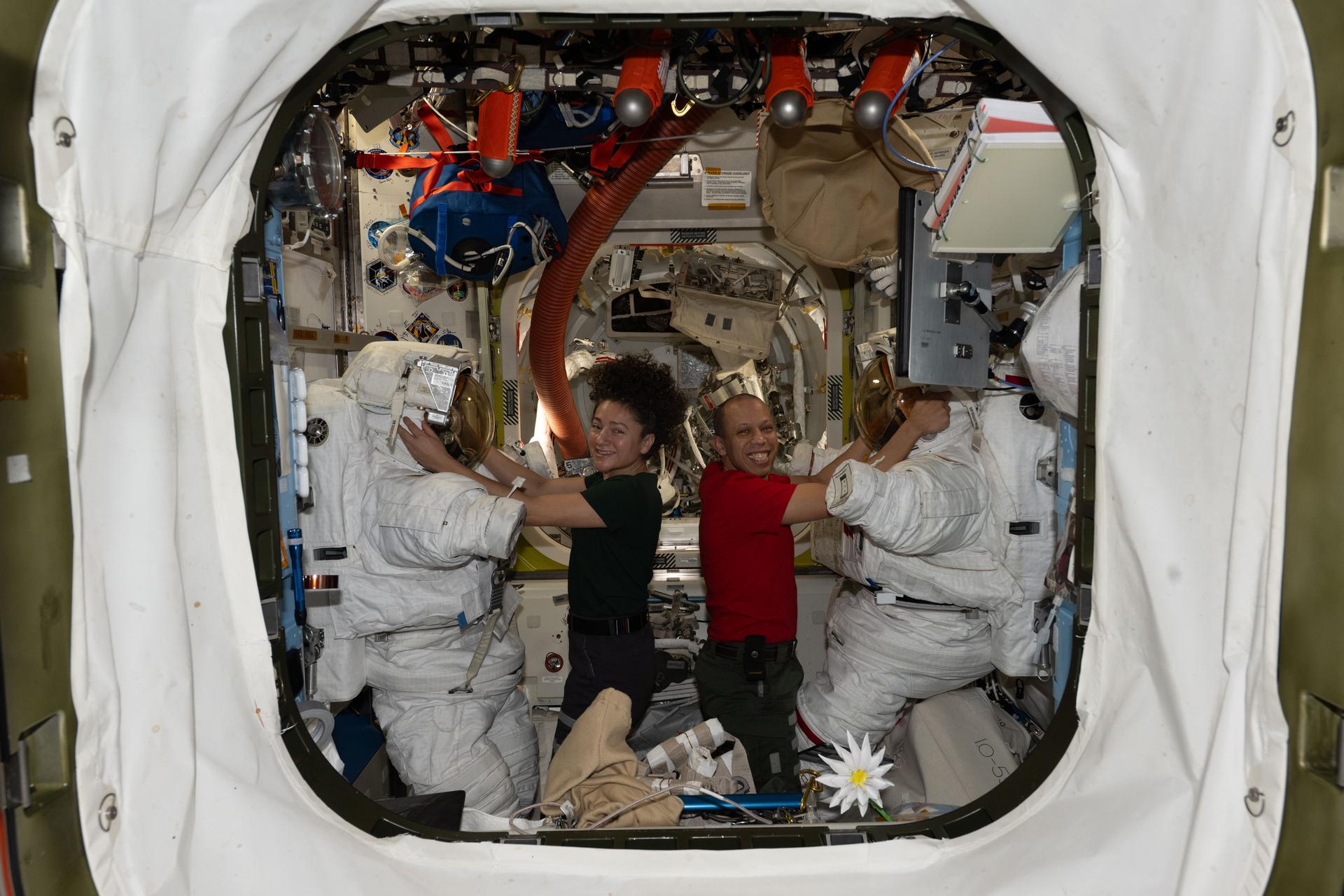 NASA astronauts Jessica Meir and Chris Williams, both Expedition 74 flight engineers, prepare their spacesuits inside the International Space Station’s Quest airlock. The following day, Meir and Williams wore the suits and exited Quest to conduct a seven‑hour‑and‑20‑minute spacewalk to replace a malfunctioning wrist joint on the Canadarm2 robotic arm.