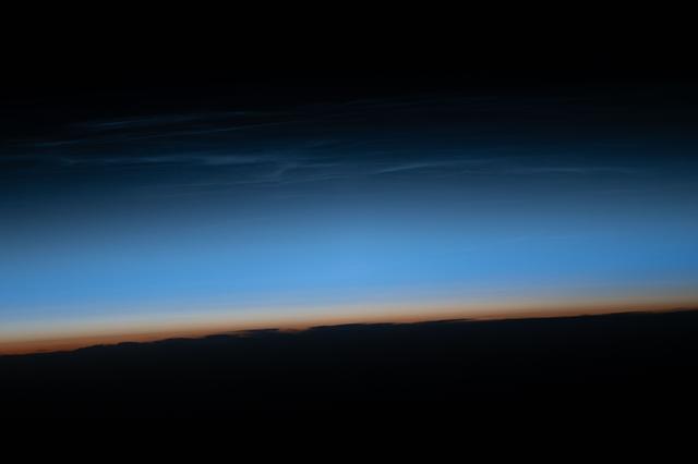 Noctilucent clouds are illuminated by sunlight just after the Sun has set below the horizon