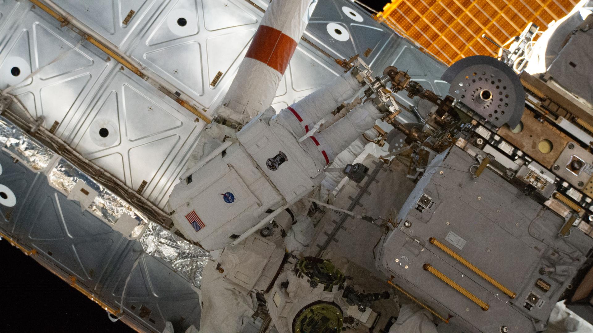 NASA astronaut Chris Williams works outside the International Space Station during a seven-hour and 20-minute spacewalk to replace a malfunctioning wrist joint on the Canadarm2 robotic arm. This was Williams' second spacewalk.