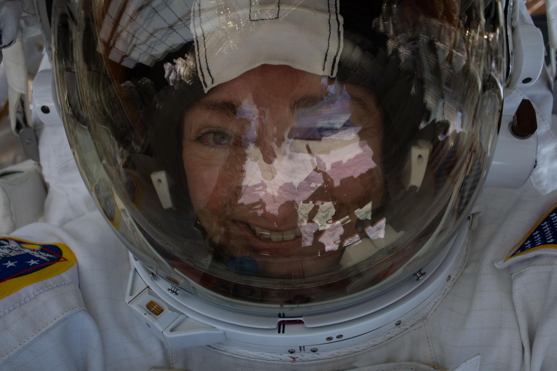 NASA astronaut and Expedition 74 flight engineer Jessica Meir smiles for an out-of-this-world "space-selfie" during a seven-hour-and-20-minute spacewalk to replace a malfunctioning wrist joint on the International Space Station's Canadarm2 robotic arm.