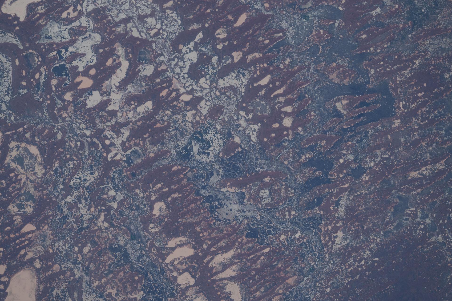 The far west region of New South Wales, Australia, along the Darling River transforms dramatically from semi‑arid plains into a vast inland wetland system during episodic heavy rainfall. The region’s high biodiversity supports woodlands, shrublands, and wildlife including kangaroos, waterbirds, reptiles, and more. The International Space Station was orbiting 265 miles above Earth at the time of this photograph.