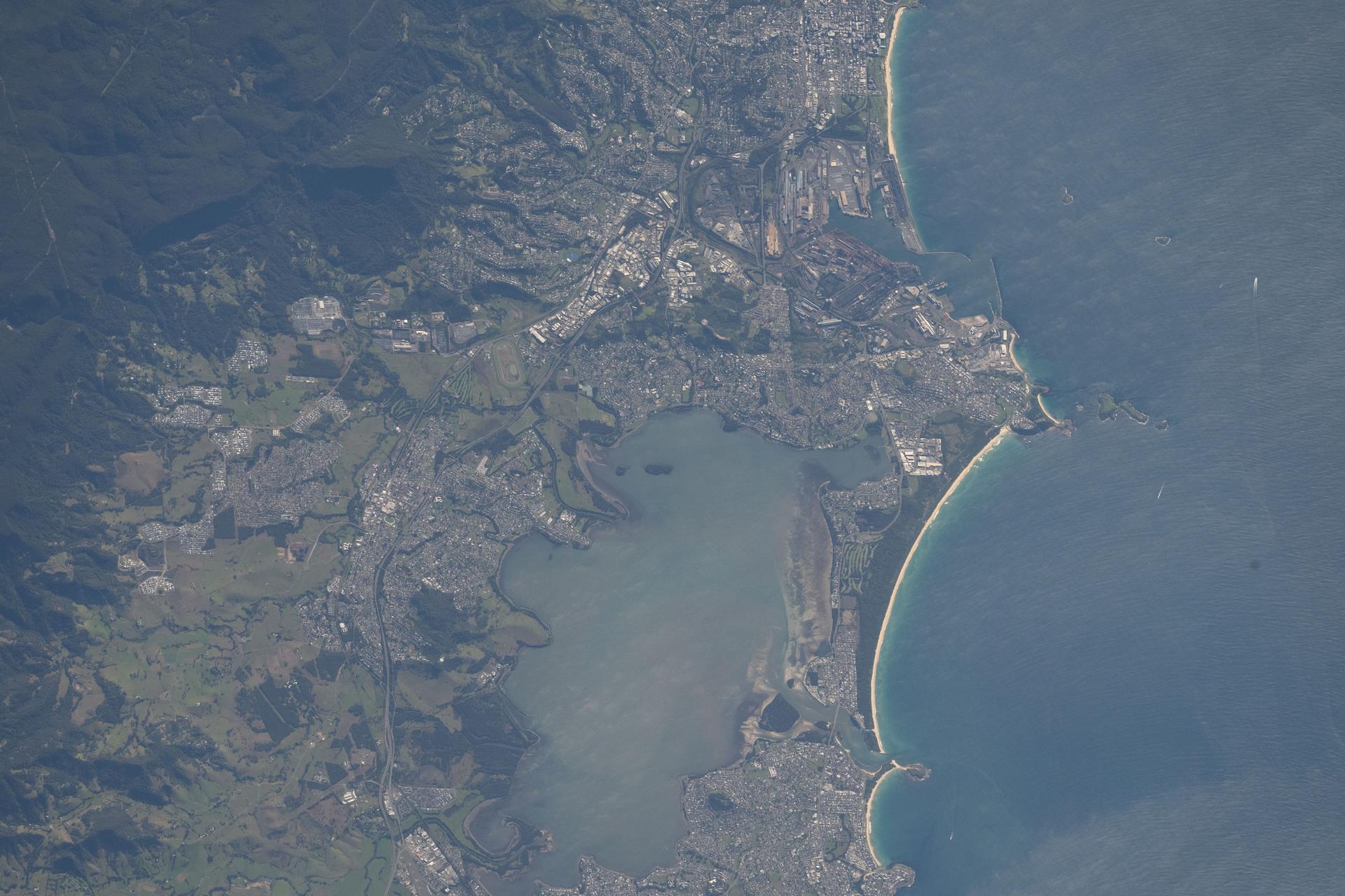 Lake Illawarra, located in New South Wales on Australia’s Pacific coast, is surrounded by numerous cities and suburbs with a regional population of over 310,000. The area is known for boating, fishing, and picnicking, and supports steelmaking, coal mining, and agricultural industries.