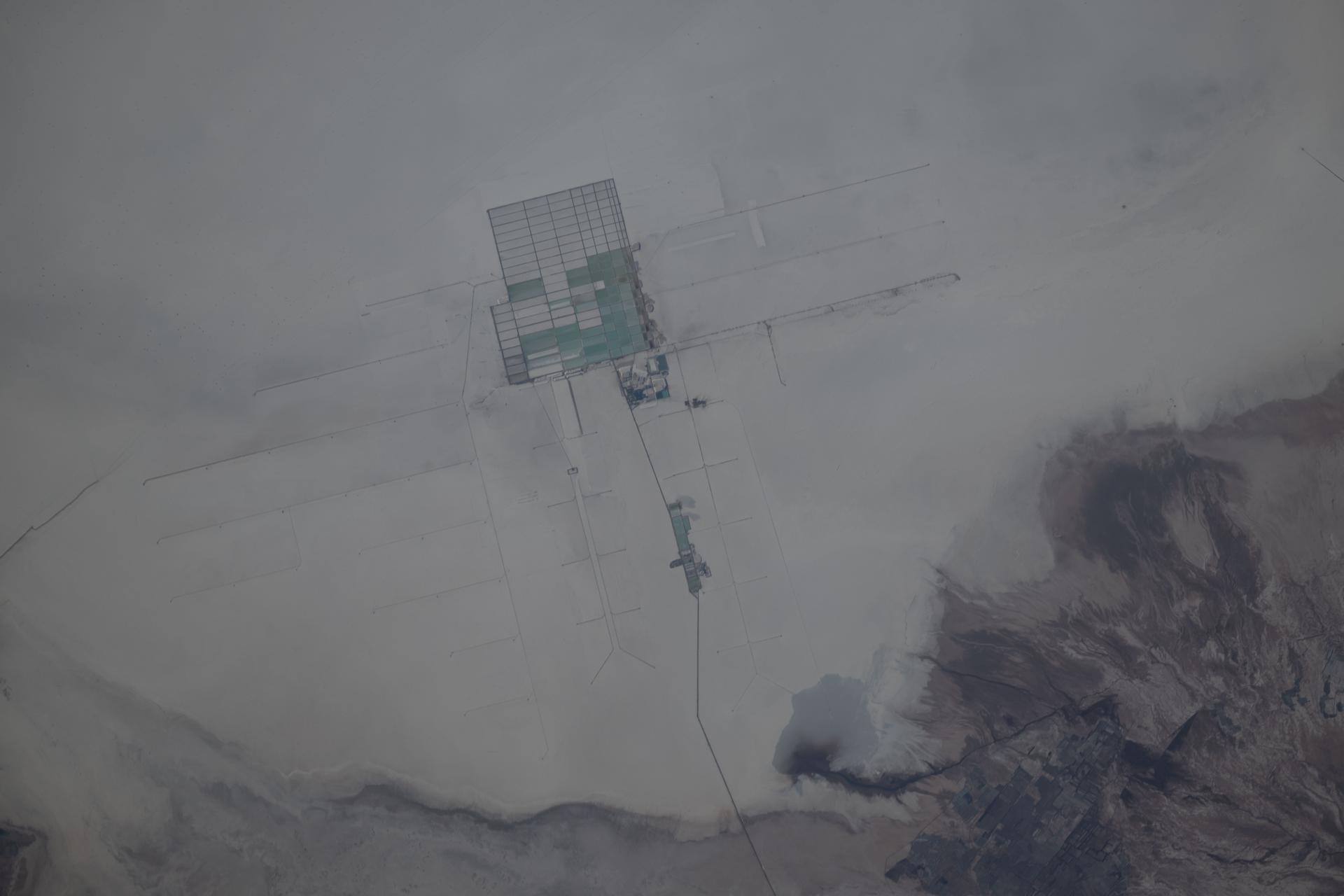 A lithium extraction facility in Bolivia's Salar de Uyuni, the world's largest salt flat and the flattest surface on Earth, is pictured from the International Space Station as it orbited 263 miles above the South American nation.