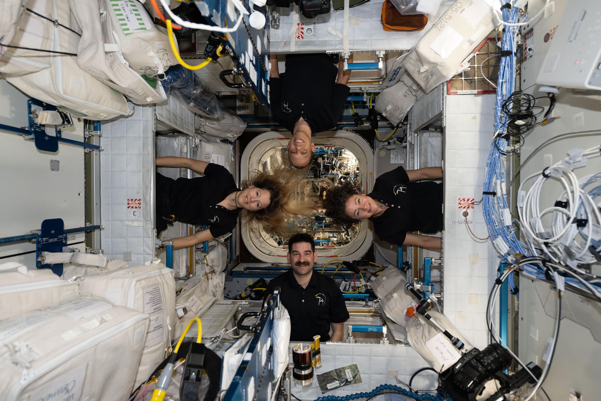 Four Expedition 74 flight engineers pose for a fun portrait inside their crew quarters aboard the International Space Station's Unity module. Clockwise from left, are ESA (European Space Agency) astronaut Sophie Adenot and NASA astronauts Chris Williams, Jessica Meir, and Jack Hathaway.