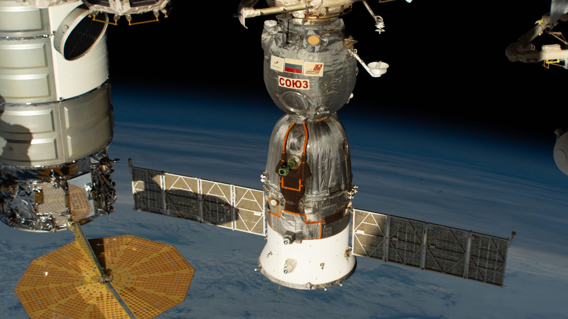 The Soyuz MS‑28 crew spacecraft, which launched and docked to the International Space Station on Nov. 25, 2025, is pictured docked to the Rassvet module. The Soyuz MS‑28 will return NASA astronaut Chris Williams and Roscosmos cosmonauts Sergey Kud‑Sverchkov and Sergei Mikaev to Earth at the end of July, completing an eight‑month space research mission.