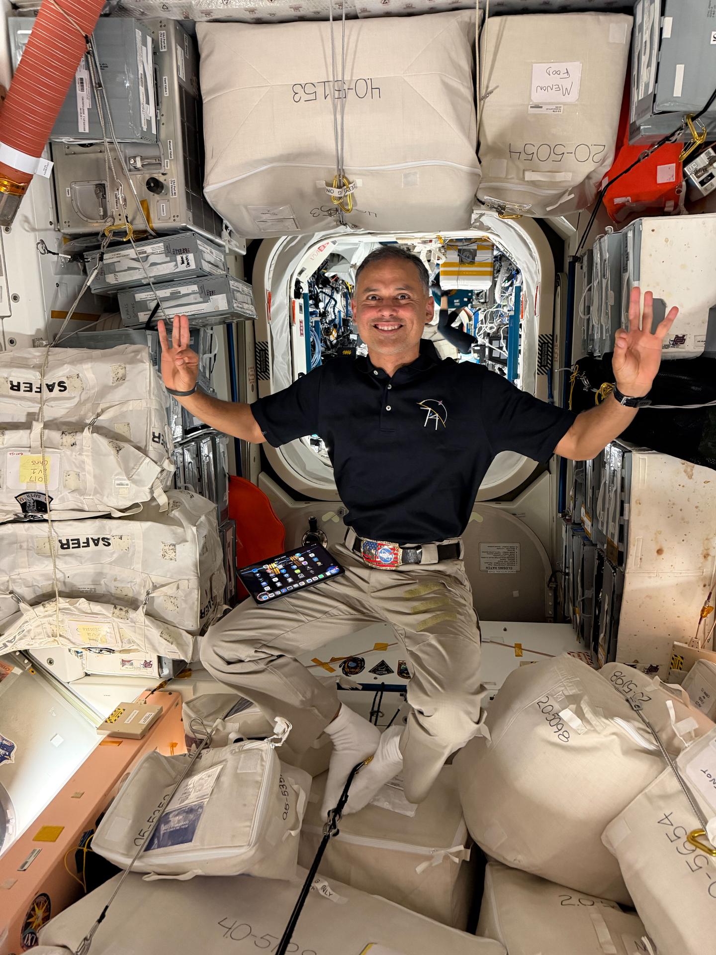 NASA astronaut and Expedition 74 flight engineer Anil Menon is pictured inside the International Space Station's Unity module familiarizing himself with lab hardware and systems during his second day in space. Menon, along with Roscosmos cosmonauts Anna Kikina and Pyotr Dubrov (both out of frame), launched aboard the Soyuz MS-29 spacecraft from the Baikonur Cosmodrome on July 14, 2026. The trio docked to the orbital outpost's Rassvet module the same day, beginning an eight-and-a-half-month space research mission.
