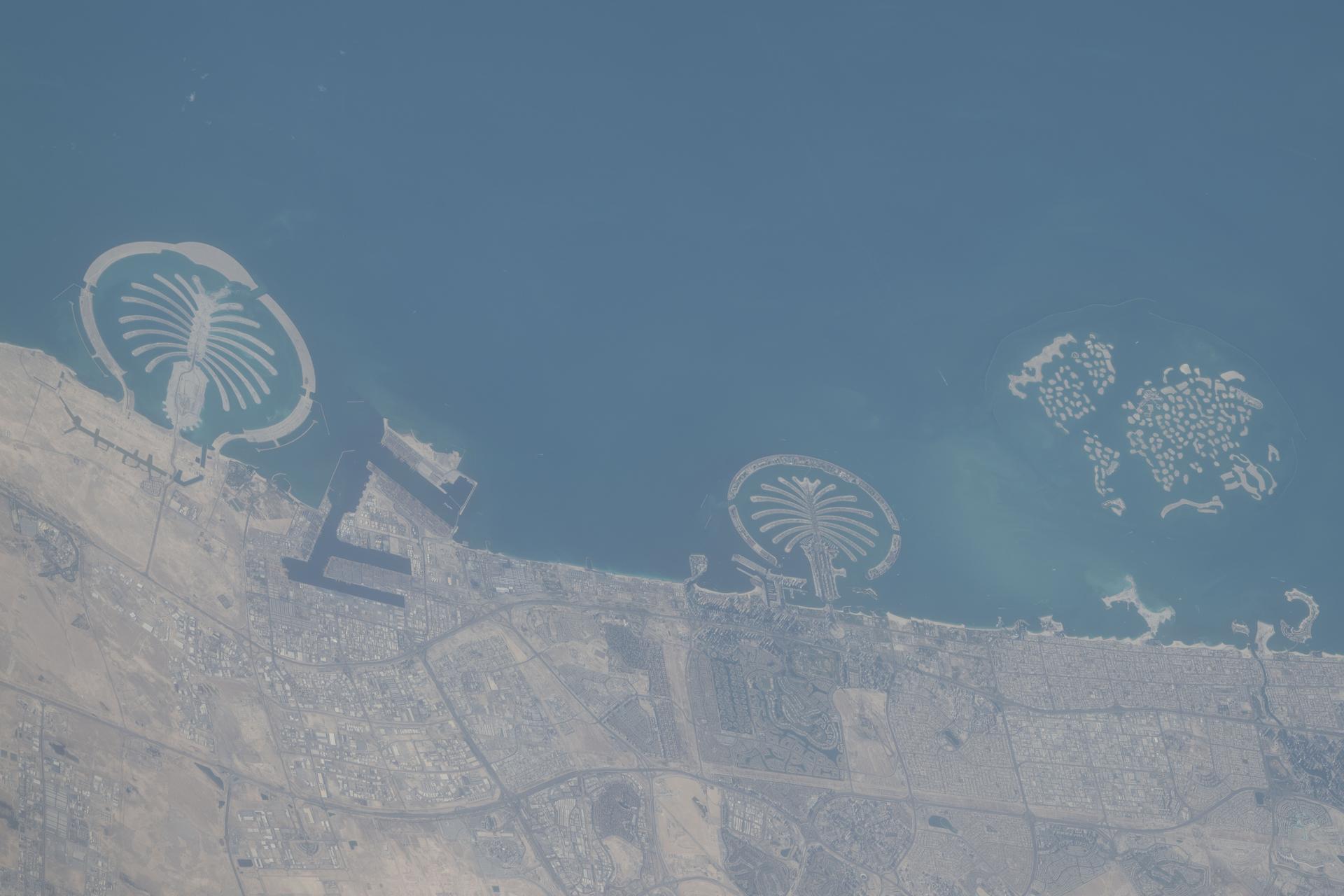Dubai's coastline, an artificial archipelago on the Persian Gulf encompassing the famous Palm Isles and The World Islands, in the United Arab Emirates, is pictured from the International Space Station as it orbited 262 miles above the Middle East.