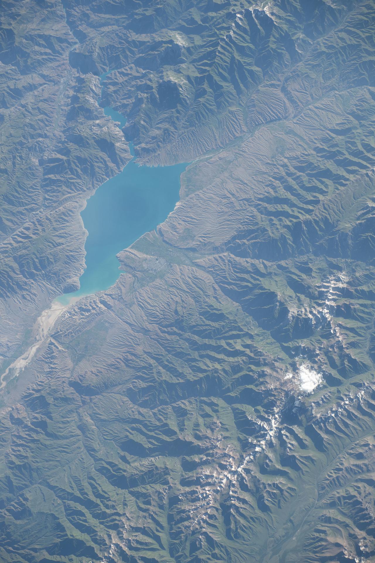Toktogul Reservoir, an artificial lake located in Kyrgyzstan's portion of the Tian Shan mountain range, was created in 1976 to supply hydroelectric power throughout the Central Asian region. The International Space Station was orbiting 265 miles above Earth at the time of this photograph.