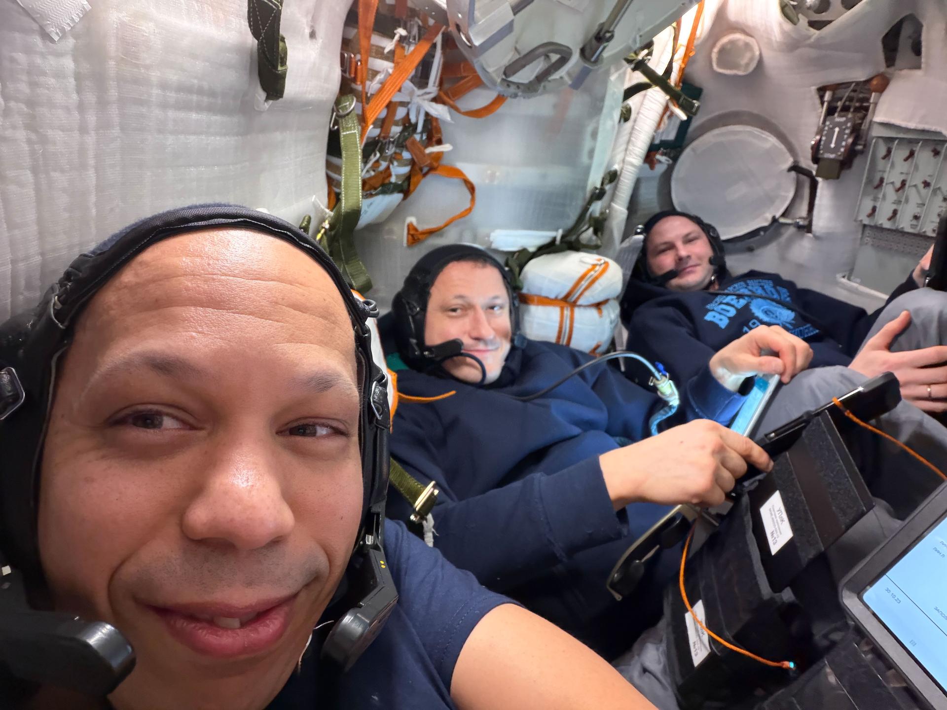 iss074e0835533 (July 23, 2026) --- From left, NASA astronaut Chris Williams and Roscosmos cosmonauts Sergey Kud‑Sverchkov and Sergei Mikaev are seated inside the Soyuz MS‑28 spacecraft docked to the International Space Station. The trio practiced and reviewed the landing procedures they would use a few days later, after undocking from the orbital outpost and parachuting to Earth aboard the Soyuz. Credit: NASA/Chris Williams