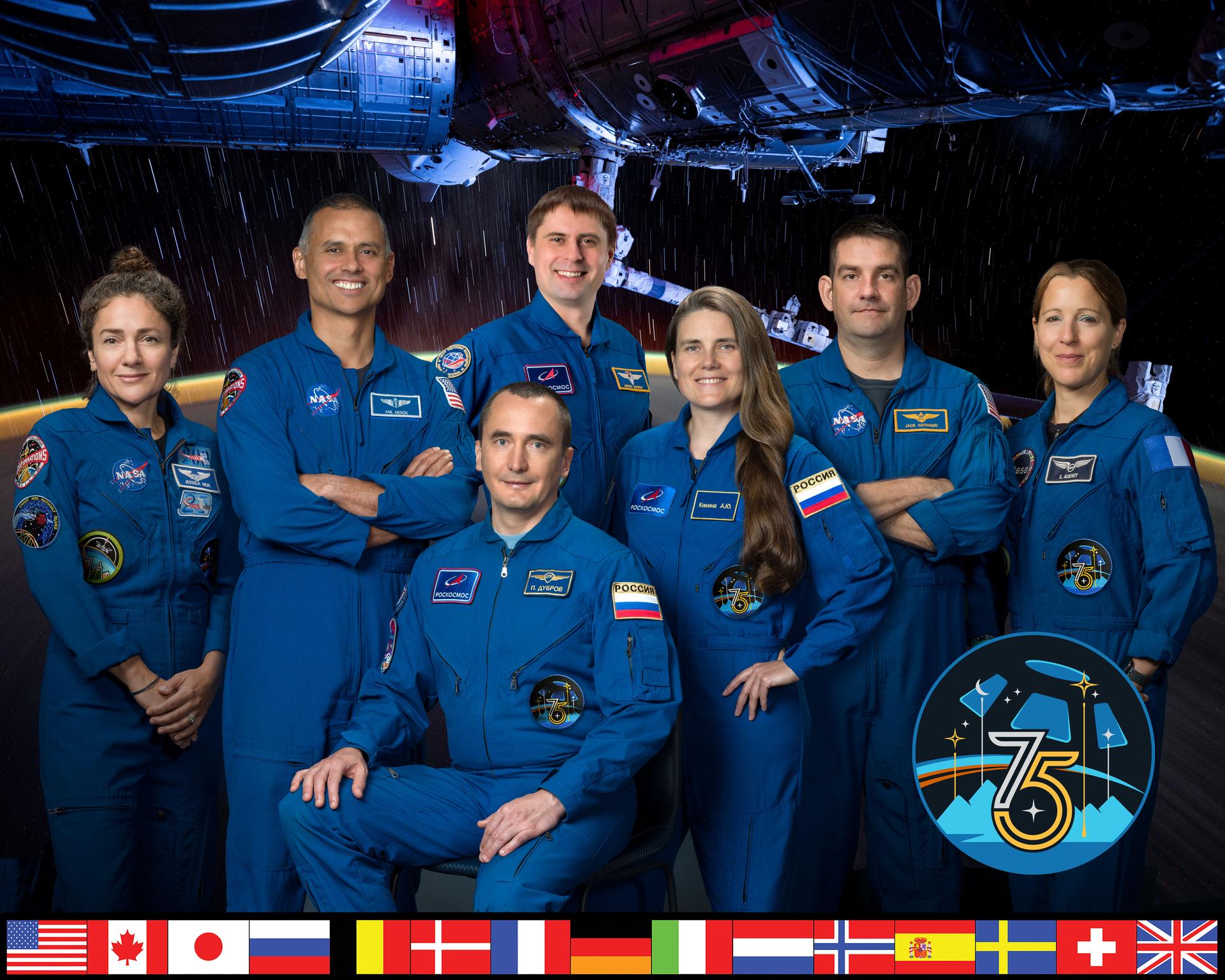 The official portrait of the seven‑member Expedition 75 crew that will live and work aboard the International Space Station. From left, are NASA astronauts Jessica Meir and Anil Menon; Roscosmos cosmonauts Pyotr Dubrov, Andrey Fedyaev, and Anna Kikina; NASA astronaut Jack Hathaway; and ESA (European Space Agency) astronaut Sophie Adenot.