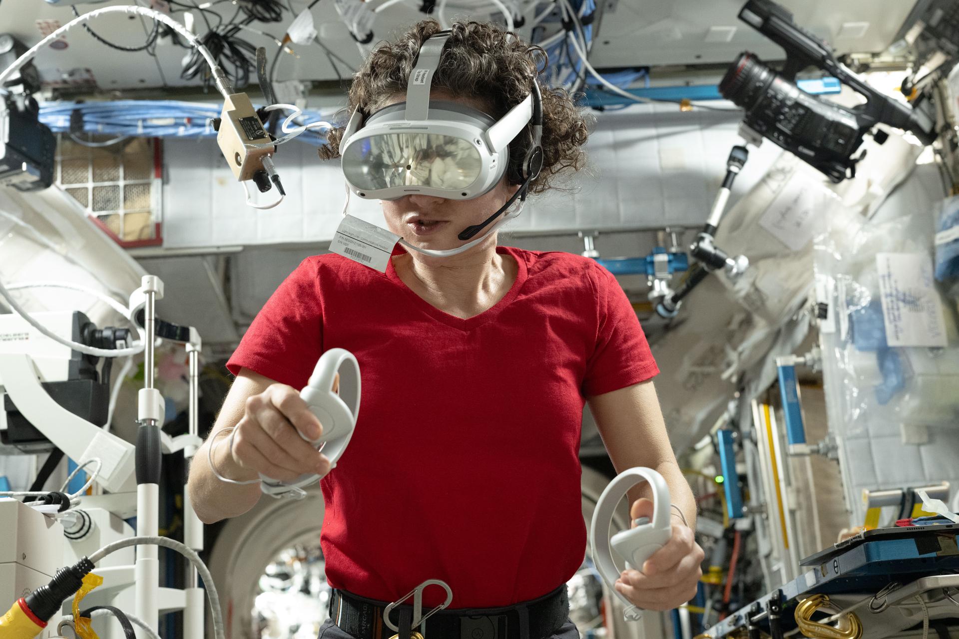 NASA astronaut and Expedition 75 commander Jessica Meir wears a set of virtual reality goggles, also called the Nevada Screening Vision System, for a test that measures visual function using a series of vision screening apps testing visual acuity, contrast sensitivity, and more.