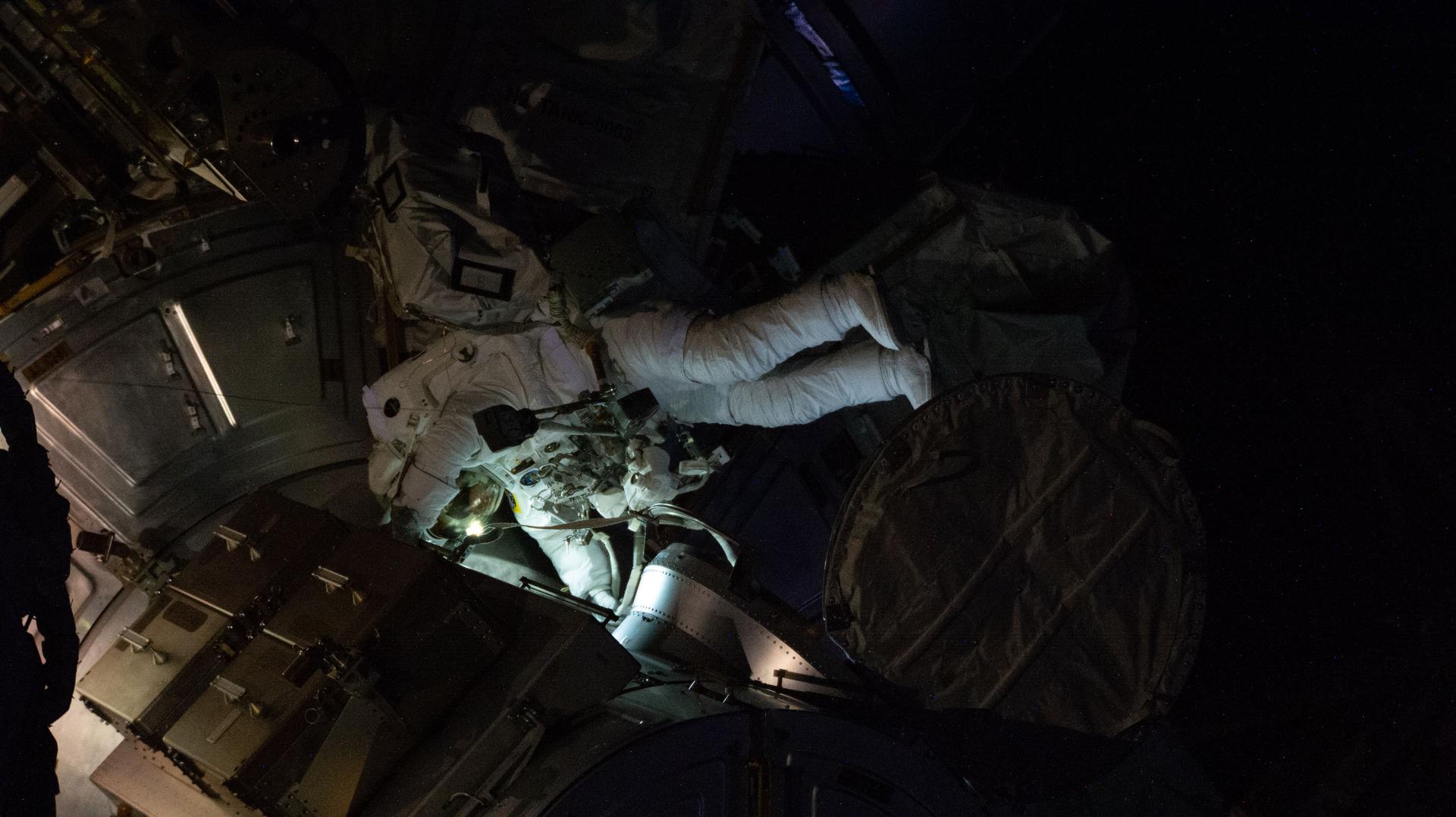 NASA astronaut and Expedition 75 flight engineer Anil Menon conducts a spacewalk to prepare the International Space Station for future upgrades to its power system. Menon worked in the vacuum of space for six hours and 37 minutes with Expedition 75 commander Jessica Meir of NASA (out of frame) building a modification kit on the station’s Starboard 6 truss segment where a roll out solar array is slated to be installed later this year.