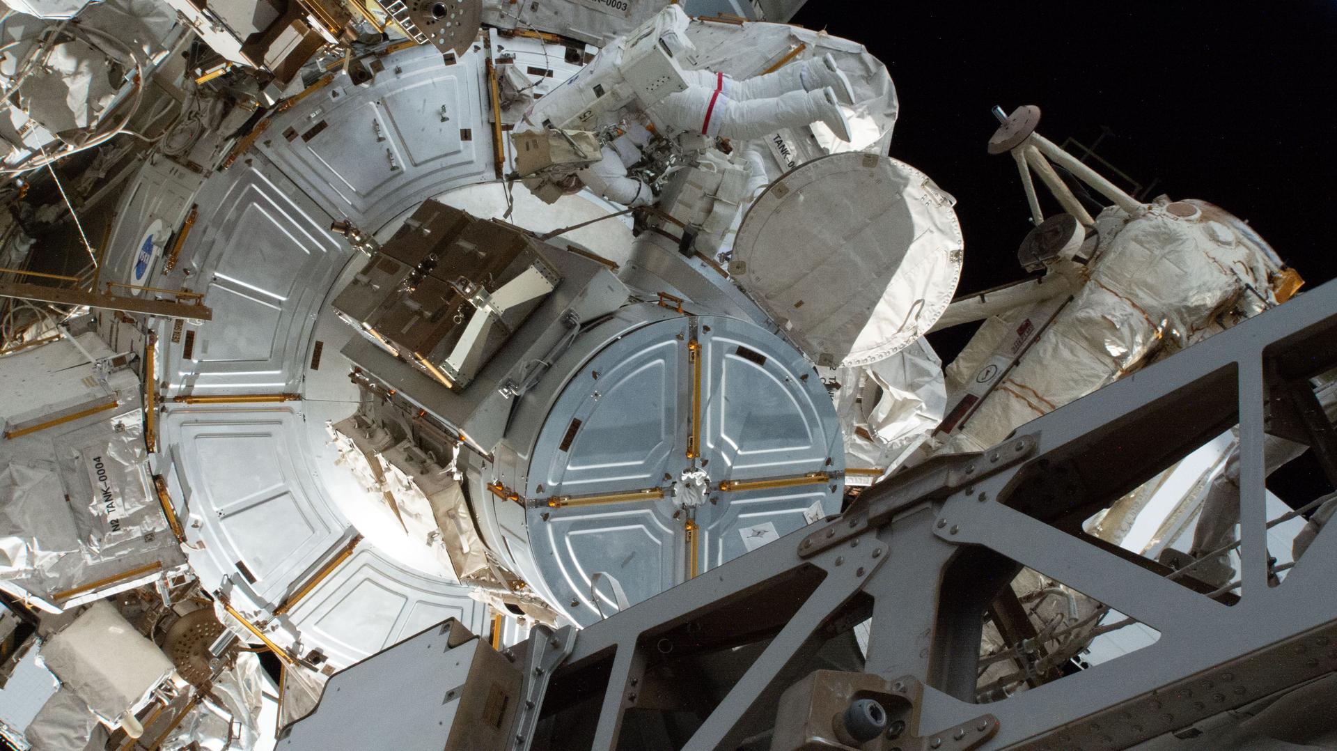 Expedition 75 flight engineer Anil Menon of NASA exits the International Space Station’s Quest airlock after beginning a six‑hour and 23‑minute spacewalk. Menon and Expedition 75 flight engineer Sophie Adenot of ESA (European Space Agency) disconnected a failed high‑speed antenna and then secured it with a long‑duration tie‑down on the orbital outpost’s Z1 truss segment. A spare antenna will be installed in its place on the Z1 during a future spacewalk.