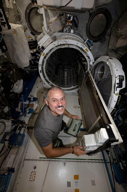 NASA astronaut Anil Menon works inside the International Space Station's Kibo laboratory module