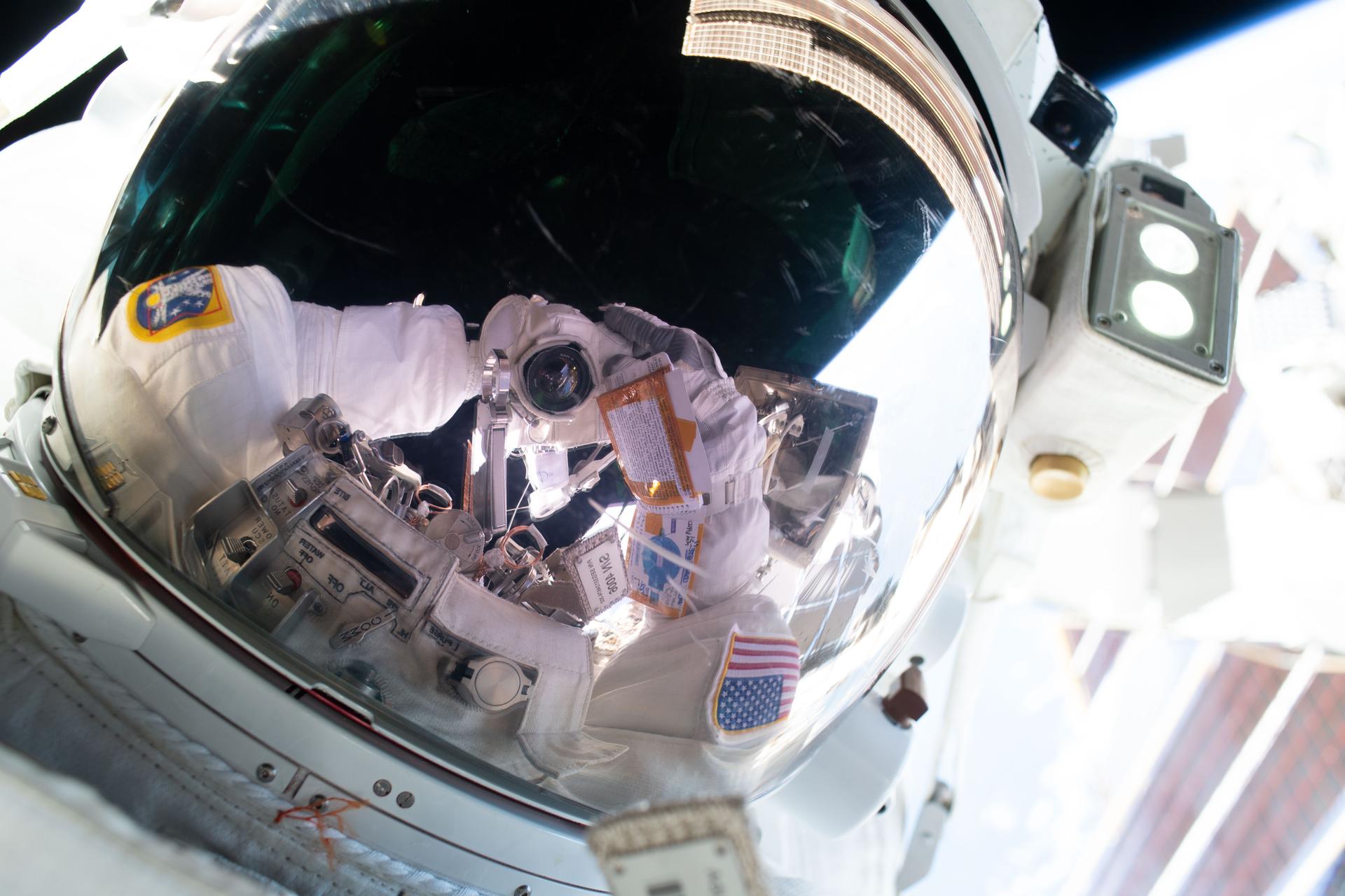 NASA astronaut and Expedition 75 flight engineer Anil Menon points his camera toward his spacesuit’s helmet visor and takes an out-of-this-world “space selfie.” Menon participated in a six-hour and 30-minute spacewalk with ESA (European Space Agency) astronaut and Expedition 75 flight engineer Sophie Adenot (out of frame) to install a high-speed space-to-ground antenna outside the International Space Station.