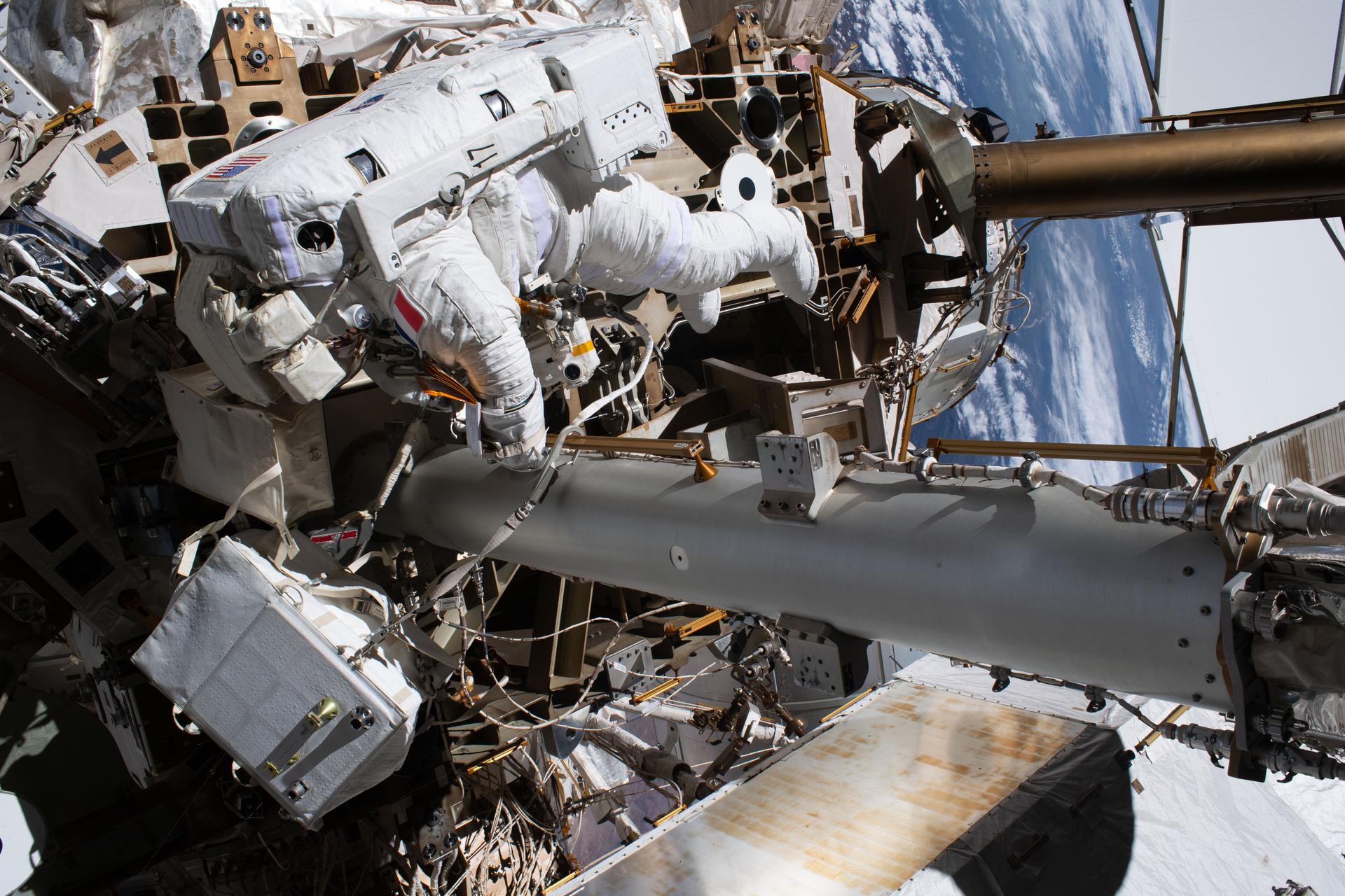 ESA (European Space Agency) astronaut and Expedition 75 flight engineer Sophie Adenot is tethered to the International Space Station during a spacewalk to install a high-speed space-to-ground antenna on the Z1 truss segment above the Unity module. Adenot and NASA astronaut and Expedition 75 flight engineer Anil Menon (out of frame) spent six hours and 30 minutes replacing a failed antenna with a spare and making the precise connections needed to activate it for high-speed transmissions with mission control.