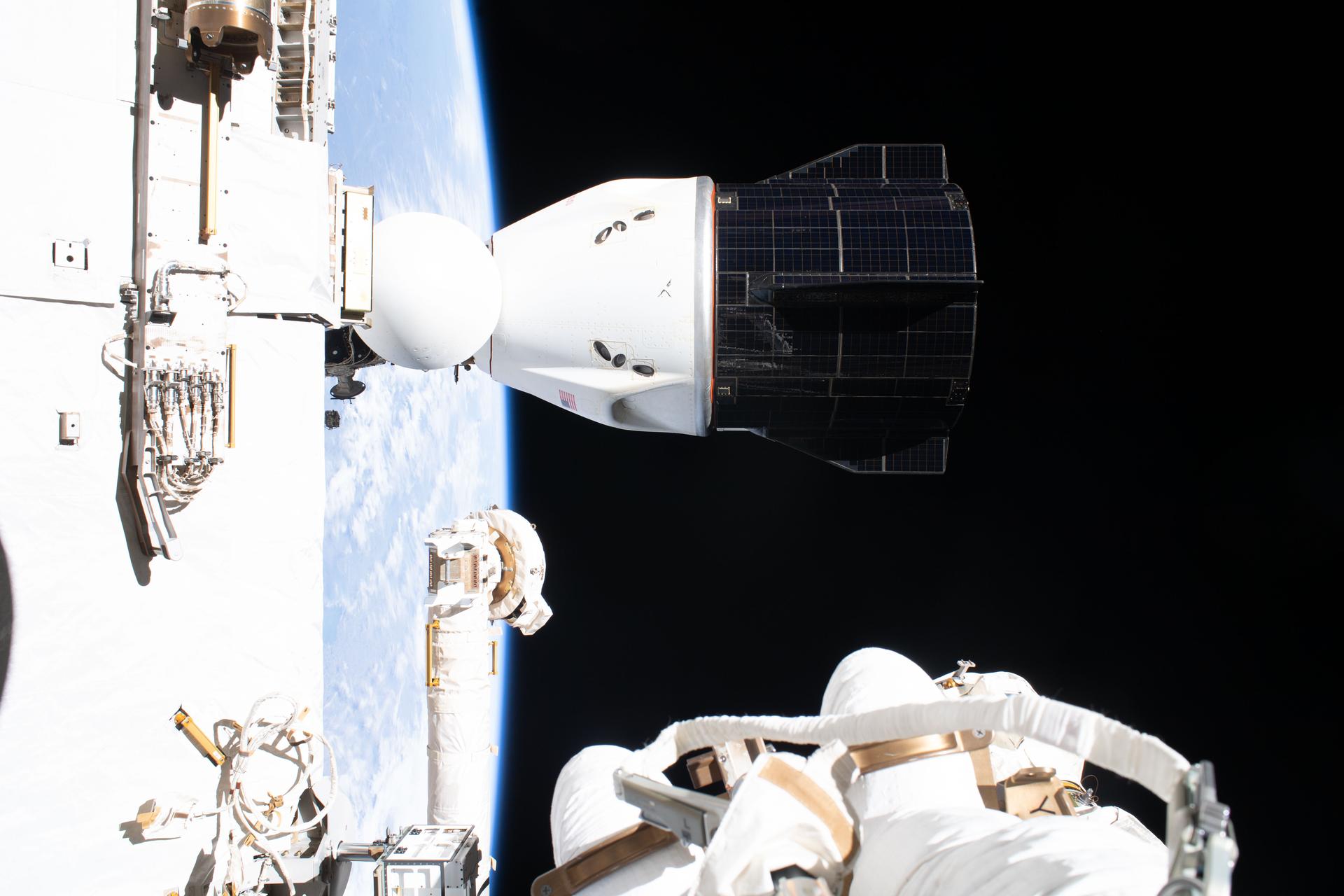 The SpaceX Dragon spacecraft docked to the International…