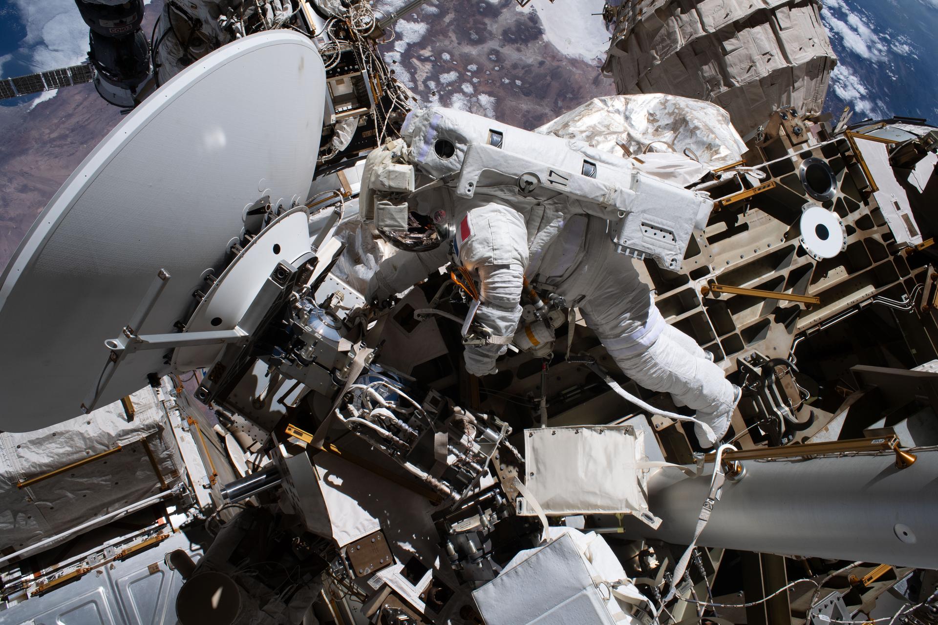 ESA (European Space Agency) astronaut and Expedition 75 flight engineer Sophie Adenot is tethered to the International Space Station during a spacewalk to install a high-speed space-to-ground antenna on the Z1 truss segment above the Unity module. Adenot and NASA astronaut and Expedition 75 flight engineer Anil Menon (out of frame) spent six hours and 30 minutes replacing a failed antenna with a spare and making the precise connections needed to activate it for high-speed transmissions with mission control.