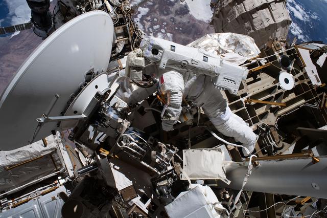 ESA astronaut Sophie Adenot is tethered to the International Space Station during a spacewalk