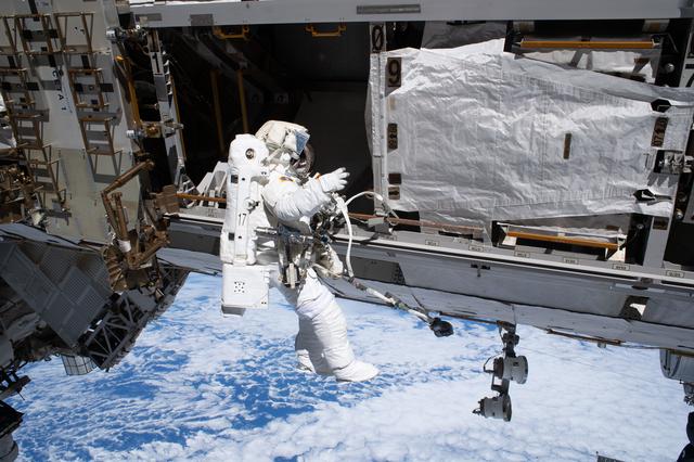 ESA astronaut Sophie Adenot is tethered to the International Space Station during a spacewalk