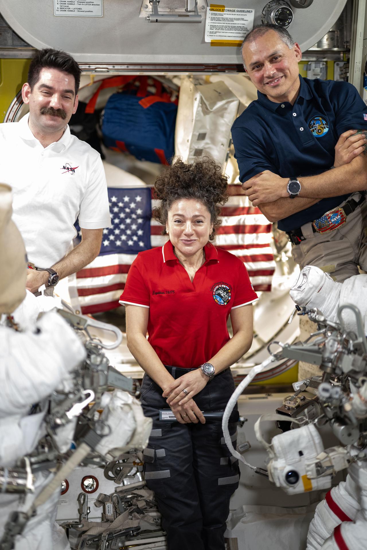 From left, flight engineer Jack Hathaway, station commander Jessica Meir, and flight engineer Anil Menon—NASA astronauts and members of Expedition 75—pose for a portrait inside the International Space Station’s Quest airlock. The trio had gathered inside Quest for a conference with U.S. President Donald J. Trump, who visited Mission Control at NASA’s Johnson Space Center in Houston, Texas, on Aug. 28, 2026.