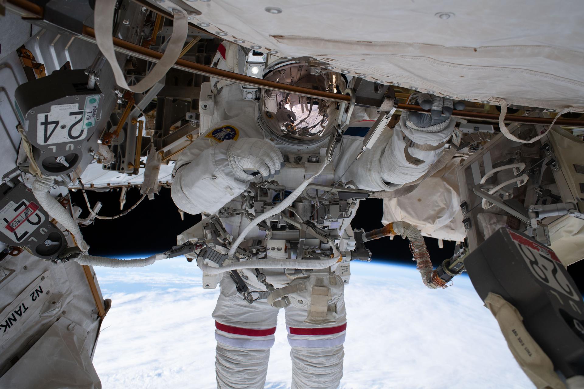 iss075e0085867 (Sept. 1, 2026) --- ESA (European Space Agency) astronaut Sophie Adenot, with her spacesuit’s gold‑plated helmet visor down, is tethered to the International Space Station. Adenot participated in a six‑hour and 49‑minute spacewalk with station commander Jessica Meir of NASA (out of frame), installing a spacecraft navigation aid, swabbing the station’s exterior for microorganisms, and preparing a cosmic particle detector for future upgrades outside the International Space Station.