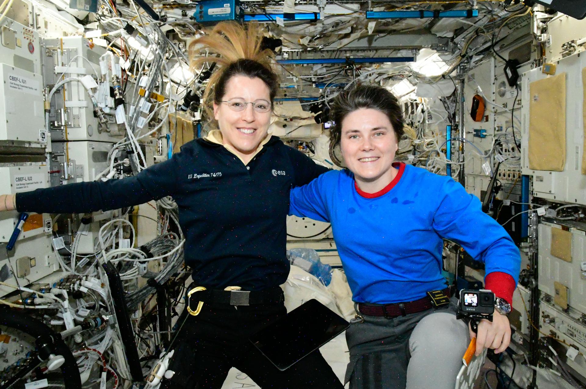 From left, Expedition 75 crew members Sophie Adenot of ESA (European Space Agency) and Anna Kikina of Roscosmos, both International Space Station flight engineers, gather together for a portrait inside the Kibo laboratory module.