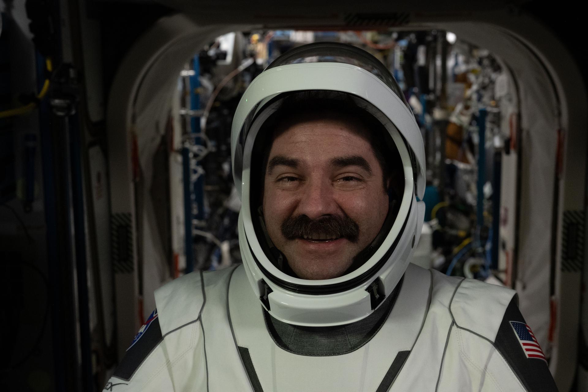 NASA astronaut and NASA's SpaceX Crew-12 pilot Jack Hathaway poses for a portrait while wearing the pressure suit he will wear when he departs the International Space Station inside the SpaceX Dragon spacecraft.