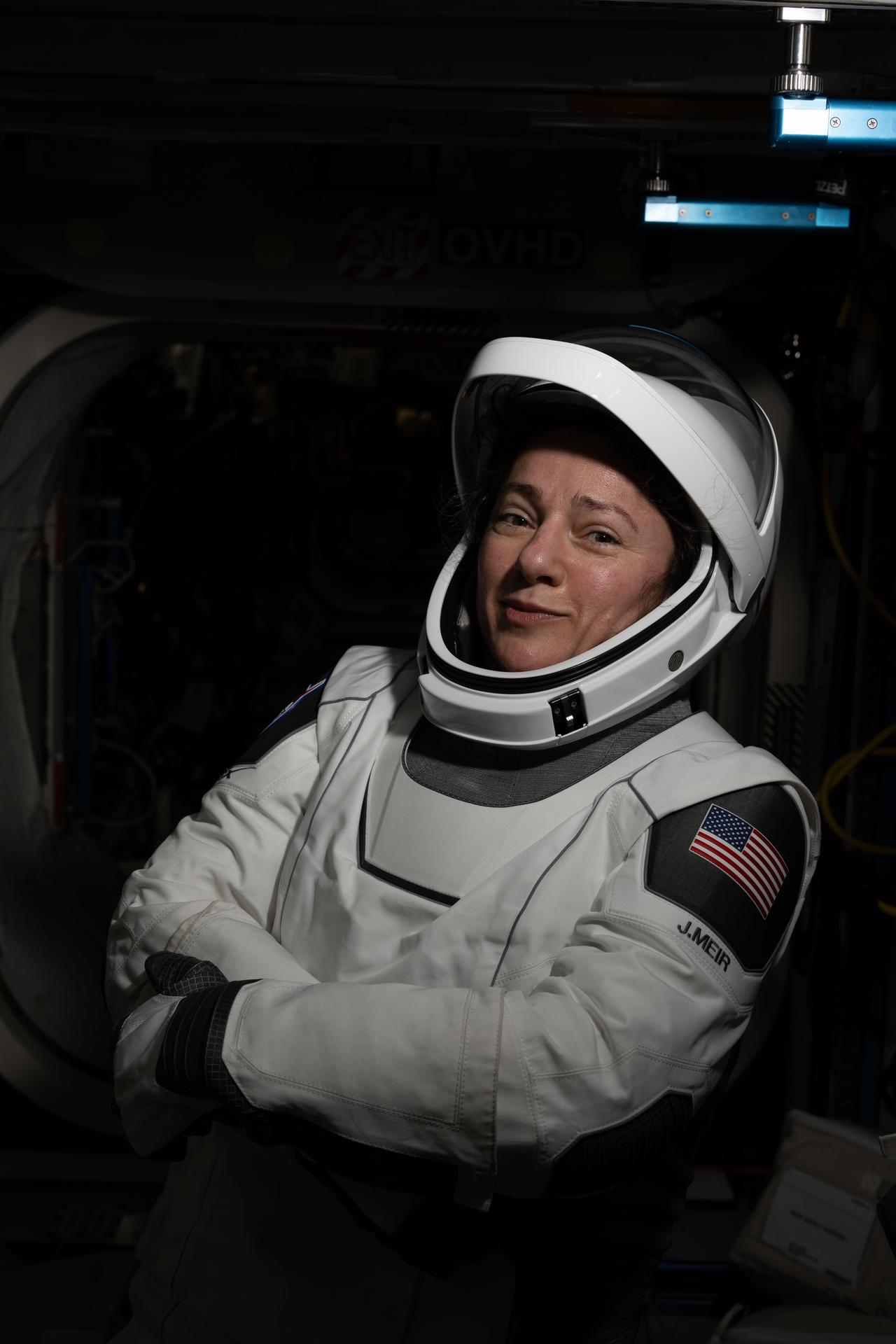 iss075e0150019 (Sept. 22, 2026) --- NASA astronaut and NASA's SpaceX Crew-12 commander Jessica Meir poses for a portrait while wearing the pressure suit she will wear when she departs the International Space Station inside the SpaceX Dragon spacecraft. Credit: NASA/Anil Menon