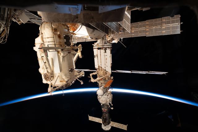 The International Space Station soars into an orbital sunset