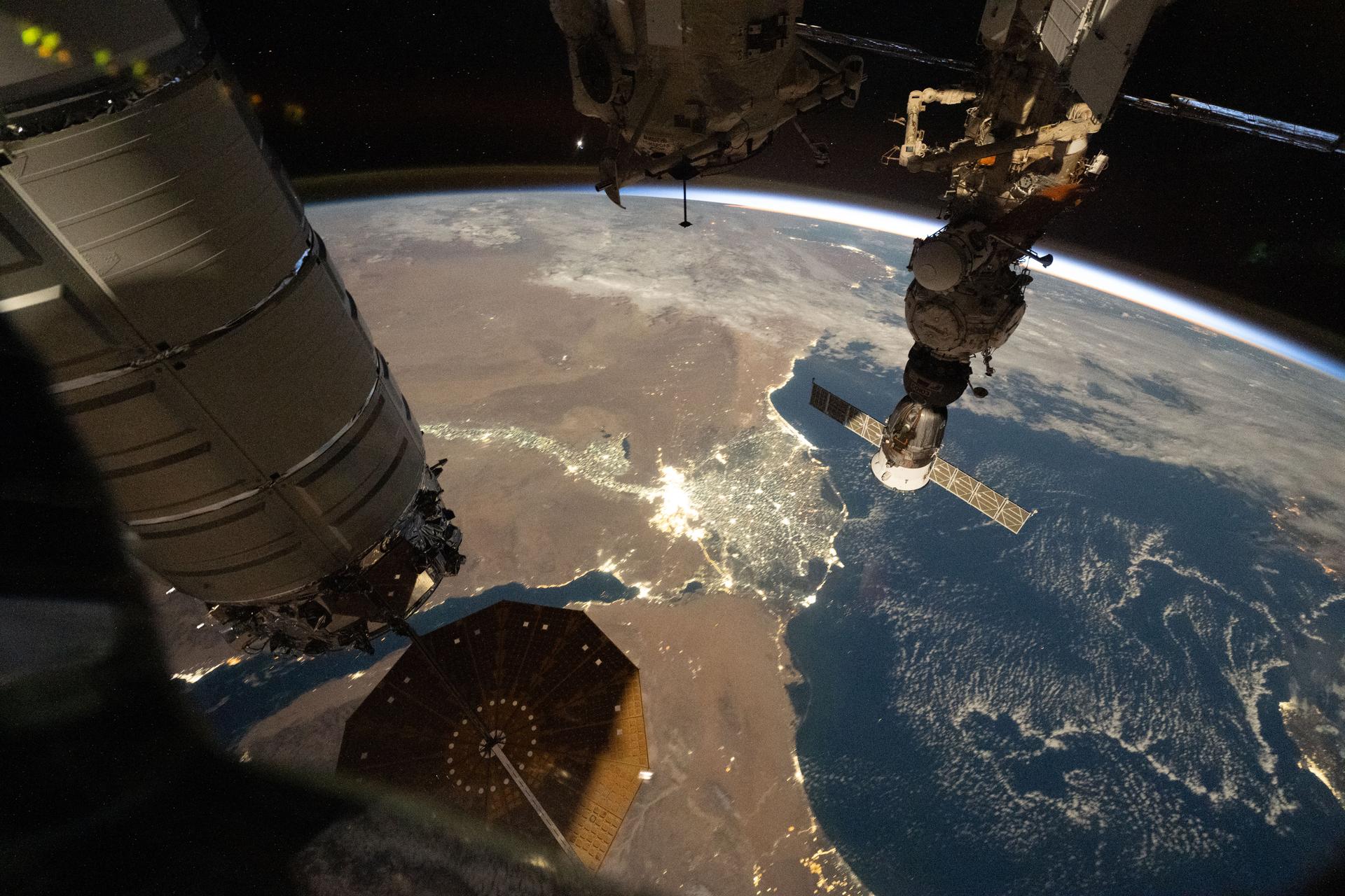 City lights outline Egypt's Nile River and highlight its delta as it empties into the Mediterranean Sea in this photograph taken at approximately 9:04 p.m. local time from the International Space Station as it orbited above Earth.