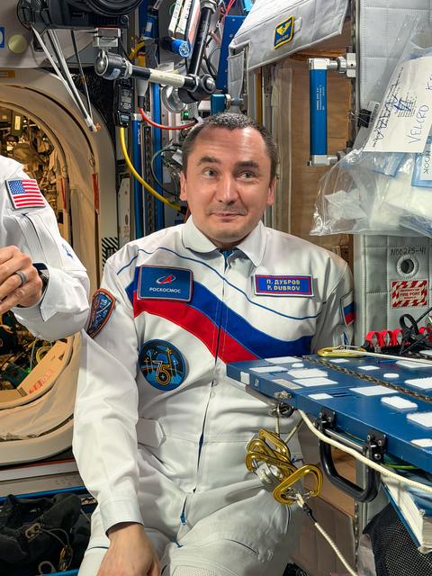 Roscosmos cosmonaut Pyotr Dubrov relaxes aboard the International Space Station