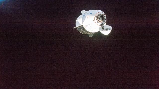 A SpaceX Dragon spacecraft approaches the International Space Station