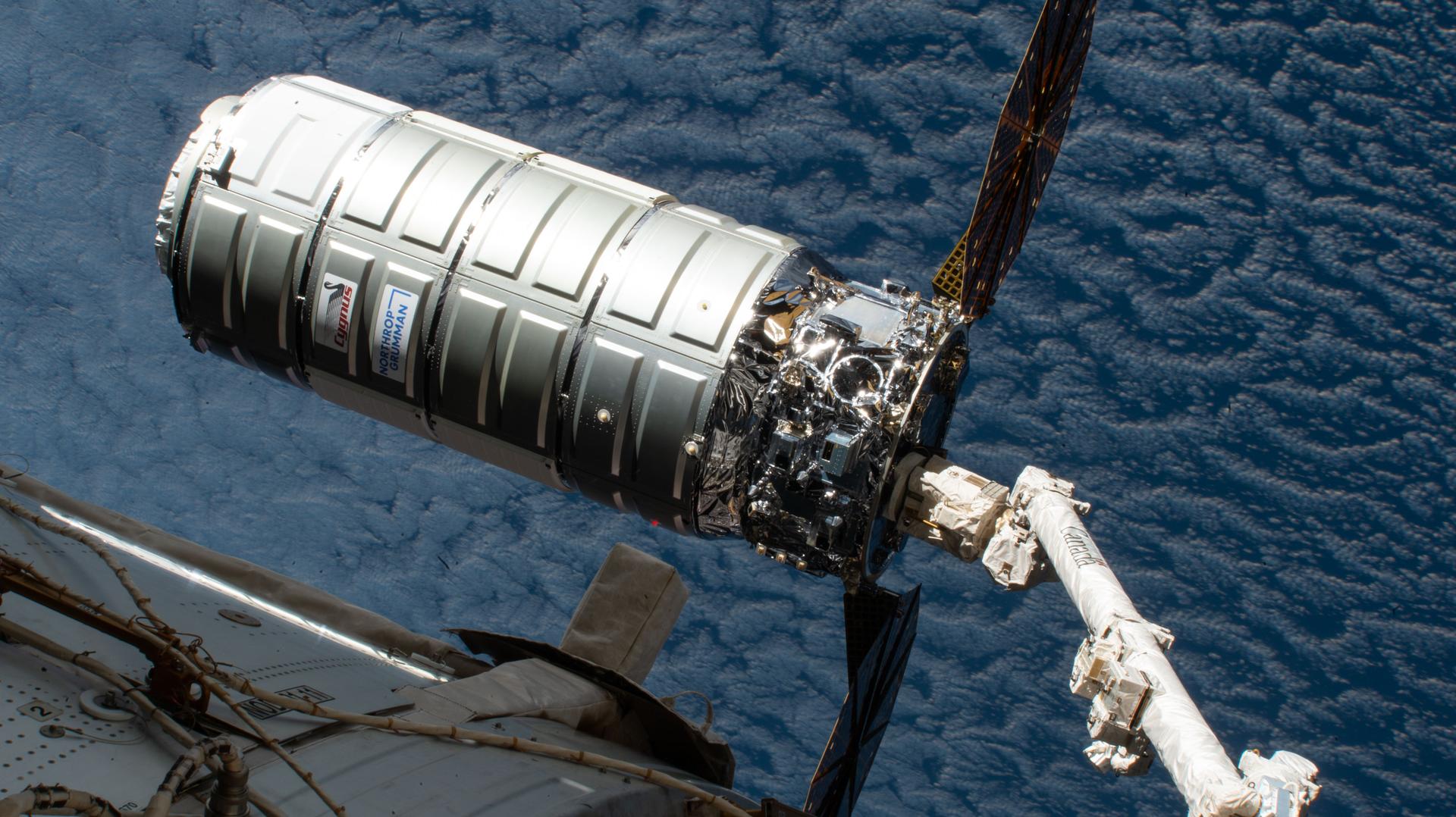 Northrop Grumman's Cygnus XL cargo spacecraft is held in the grip of the Canadarm2 robotic arm before its release from the International Space Station as both spacecraft orbited 265 miles above the North Atlantic Ocean. Cygnus XL reentered Earth's atmosphere three days later burning up harmlessly over the Pacific Ocean completing a six-month resupply mission at the orbital outpost.