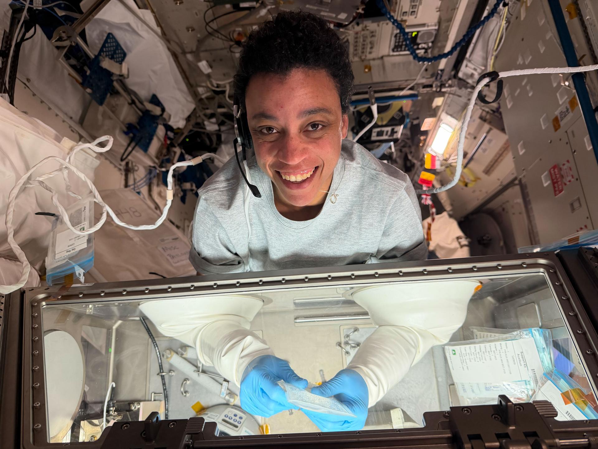 NASA astronaut and Expedition 75 flight engineer Jessica Watkins works inside the Kibo laboratory module's Life Science Glovebox, safely mixing living cell samples with a bioink and then filling a special cartridge with the cell‑ink mixture. The advanced research operations were part of the InSPA‑Auxilium Bioprinter‑Cell Printing investigation, which explores 3D bioprinting cartilage tissue in microgravity of higher quality than that produced on Earth. Results may advance the ability to biomanufacture cartilage, benefiting patients on Earth and crew members on long‑duration space missions.