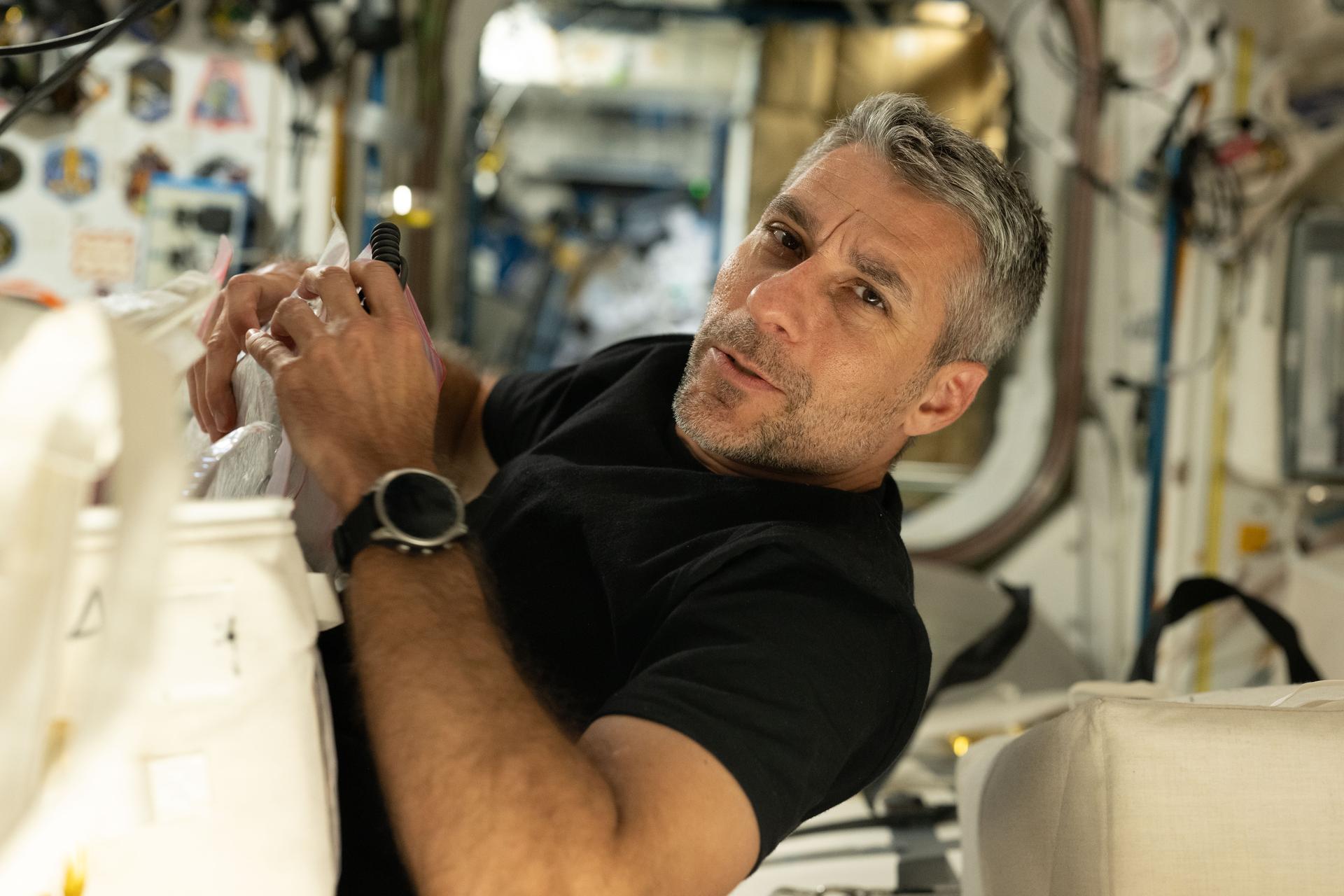 NASA astronaut and Expedition 75 flight engineer Luke Delaney inspects and cleans ventilation system components aboard the International Space Station. Delaney also collected airflow measurements, helping ground teams assess the overall health of the station’s ventilation system, identify blockages, and verify that air circulates properly to maintain hardware functionality and crew comfort.