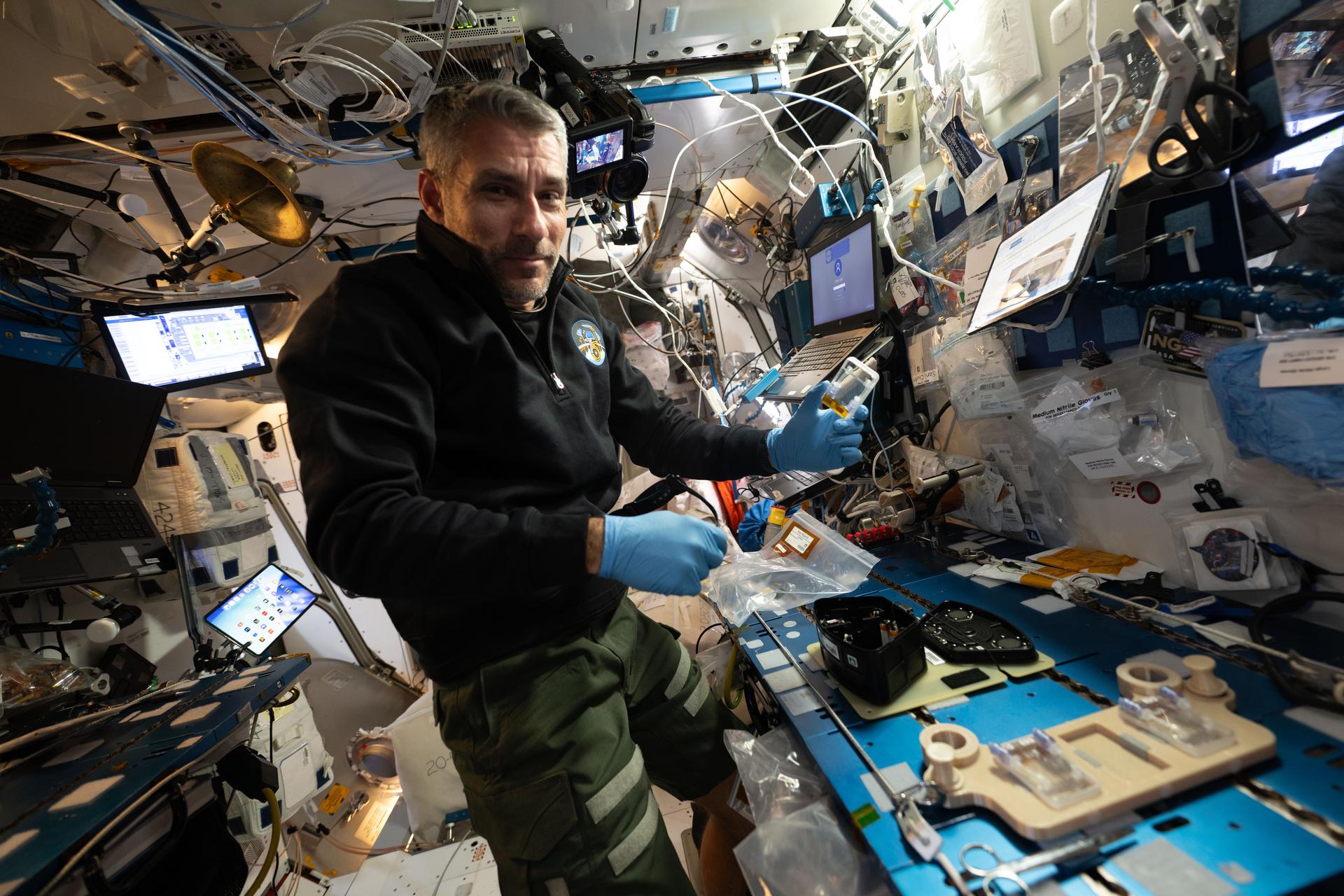 NASA astronaut and Expedition 75 flight engineer Luke Delaney works inside the International Space Station’s Harmony module on a space botany investigation. Delaney configured petri plates and experiment modules to help researchers observe the genetic responses of plants growing in microgravity, advancing the development of spacecraft life‑support systems.