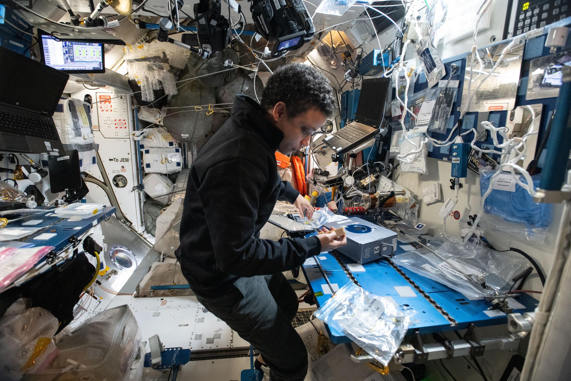 NASA astronaut and Expedition 75 flight engineer Jessica Watkins services delicate sample‑processing hardware and inspects its internal components before stowing it in a science freezer aboard the International Space Station. The Advanced Space Experiment Processor‑2 (ADSEP‑2) can be configured for cell and tissue culturing, protein crystal growth, microorganism studies, and materials science research with colloids.