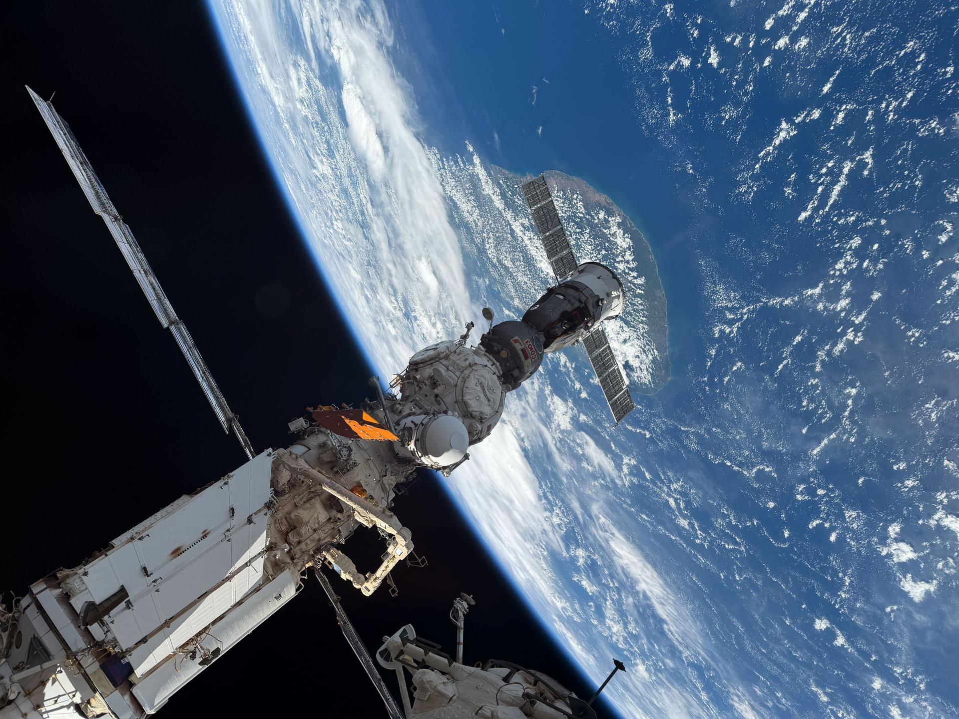 The Soyuz MS‑29 crew spacecraft is pictured docked to the Prichal module as the International Space Station orbited 261 miles above the Indian Ocean southeast of the island nation of Sri Lanka.