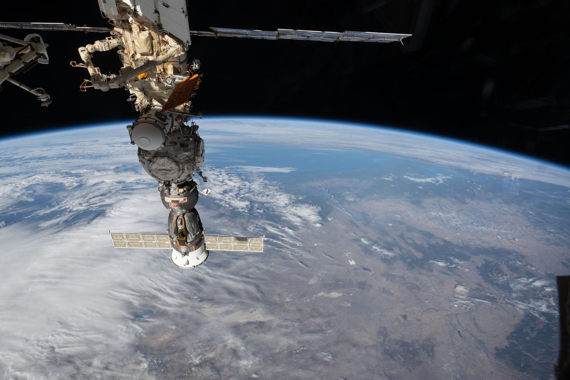 The Soyuz MS‑29 crew spacecraft is pictured docked to the Prichal module as the International Space Station orbited 261 miles above the Central American nation of Belize.