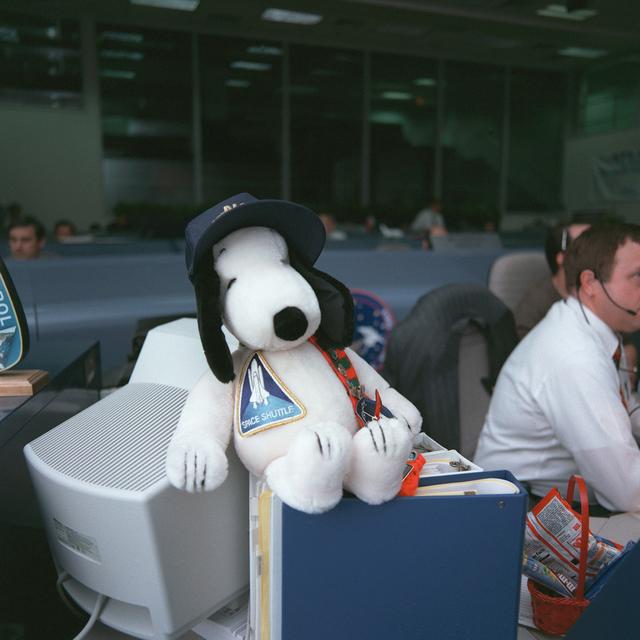 NASA image: Stuffed Snoopy wearing cap and sporting a Space Shuttle emblem
